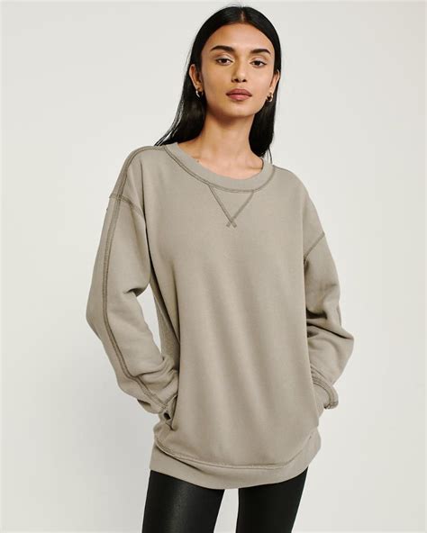 Stay Cozy in Style with Our Cut Crew Neck Sweatshirt